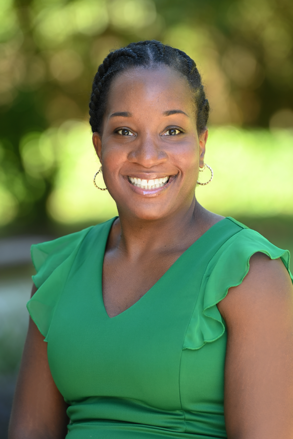 Danyelle smiling and wearing green top