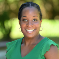 Danyelle smiling and wearing red top