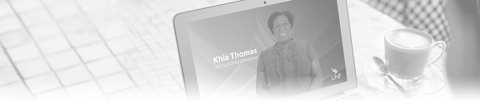 person watching an instructional designer video on her laptop