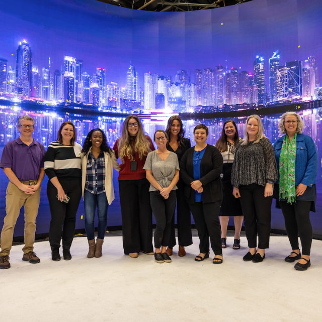 a group of people with a city skyline in the background