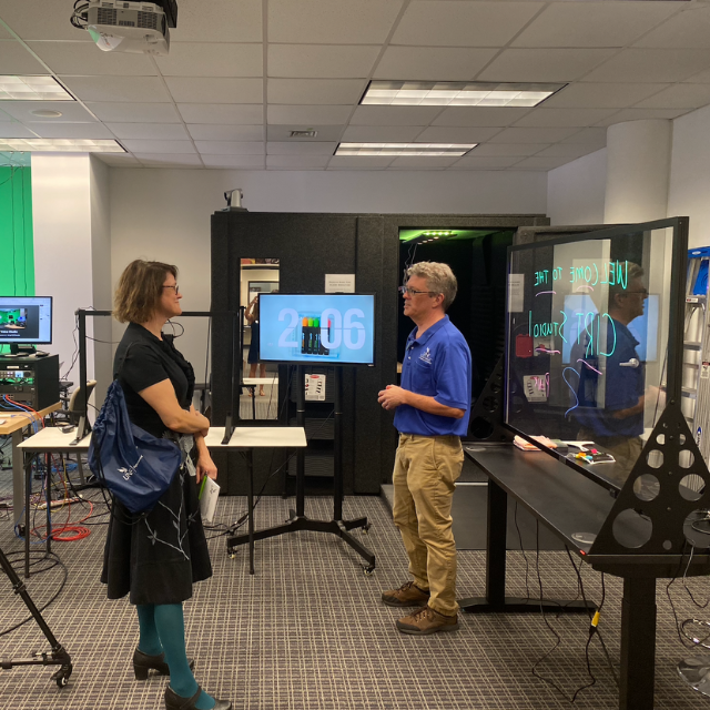 two people talking in a video studio