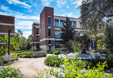 UNF Social Sciences building and globe statue