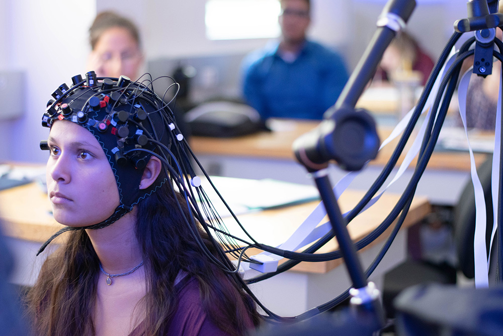 Girl wearing head gear to scan the brain