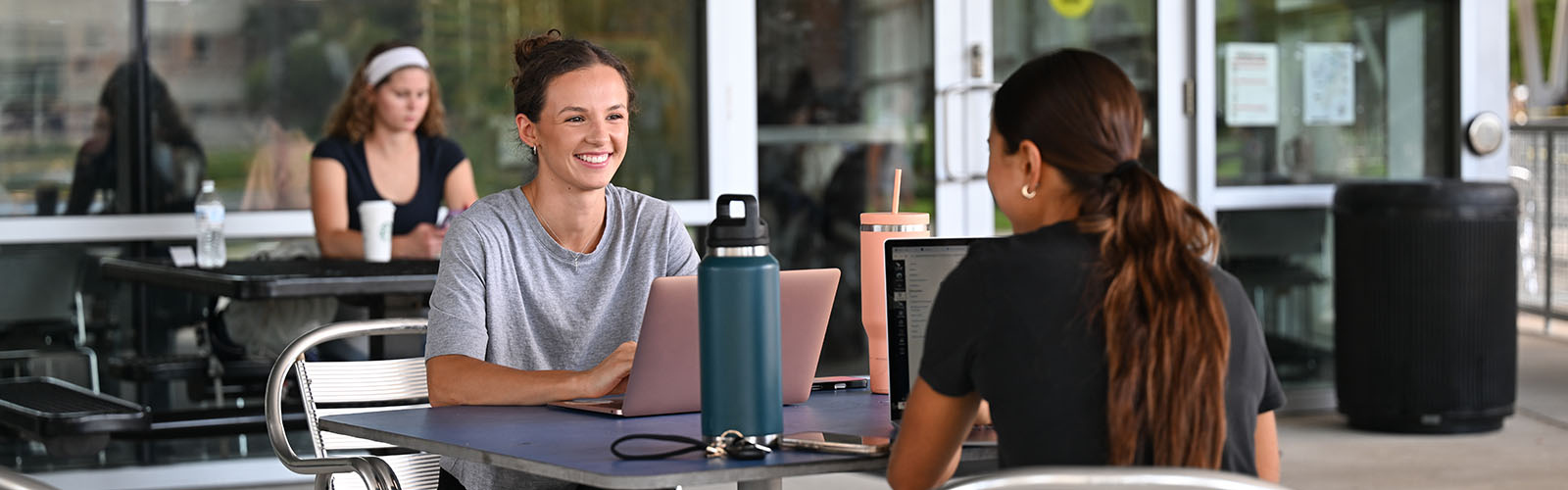 Students at a table in the Student Union