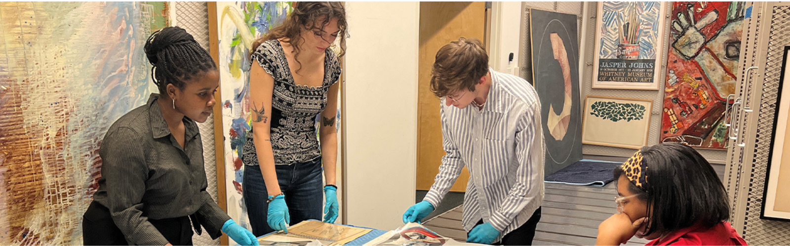 UNF Art students analyzing art artifacts at their internship