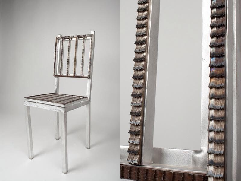 Contemporary chair design with a sleek metallic frame and textured wooden seat slats. The unique blend of materials showcases modern craftsmanship.