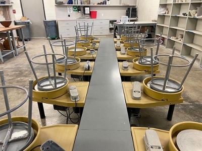 Ceramics wheels with stools stacked on top