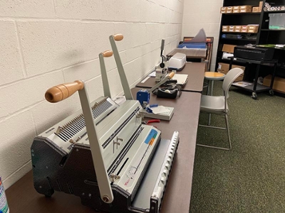 binding and laminating equipment in the production lab