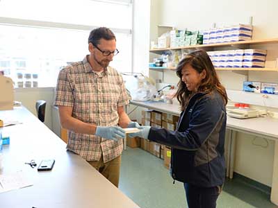 Dr Hatle and Jillian in his lab
