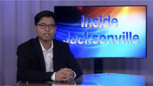 Katrino Reyes doing a broadcast from the TV studio desk.