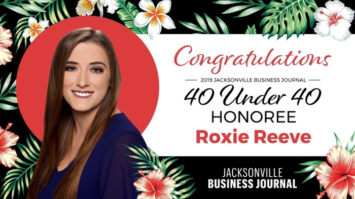 Roxie Reeve with flowers text of congratulations 2019 Jacksonville Business Journal 40 Under 40 Honoree Roxie Reeve