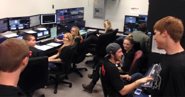 Communication students prepare the control room to record the basketball game.