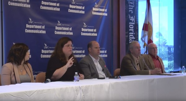 A panel of media representatives speak about fighting fake news.