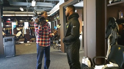 Marcel Robinson with camera in the Jaguars locker room.