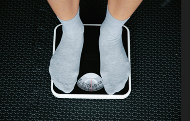 feet standing on a scale
