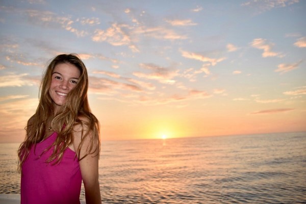 Tabitha Bingham, a School of Communication scholarship winner, enjoys the sunset at the beach.