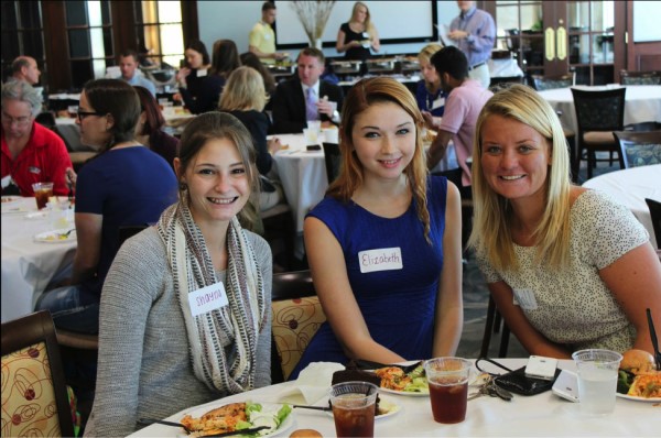 Three students eat lunch at Media Week and networked with professionals.