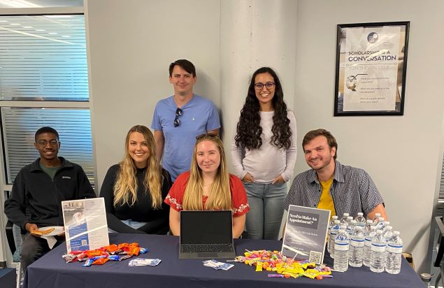 Writing Consultants tabling at the library's Research Week.