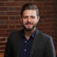 Headshot of E. Kyle Romero