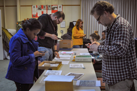 Students examining historic documents in archive