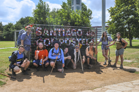 Students beside Camino de Santiago pilgrim marker