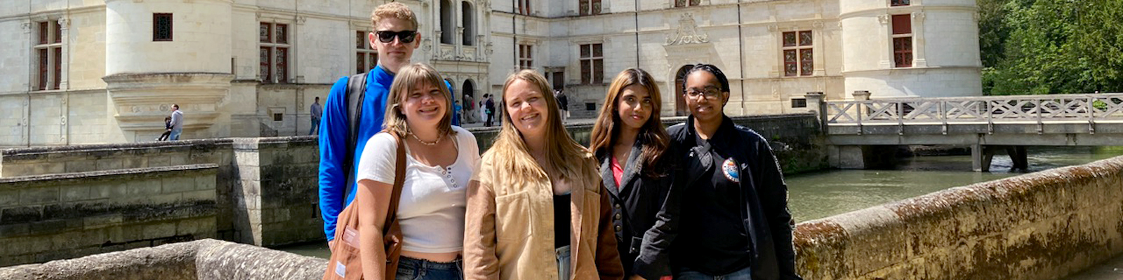 5 UNF French Language Students pose in front of Château d'Azay-le-Rideau during their summer Study Abroad in Tours, France