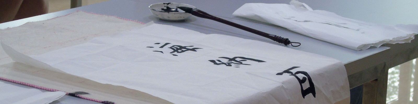 chinese script written on cloth with ink and quill