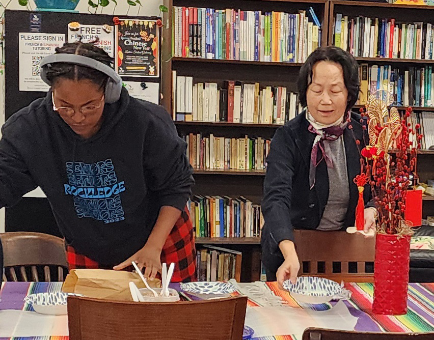 UNF students of Chinese make dumplings for the Chinese New Year with Professor Mei Lian Lu