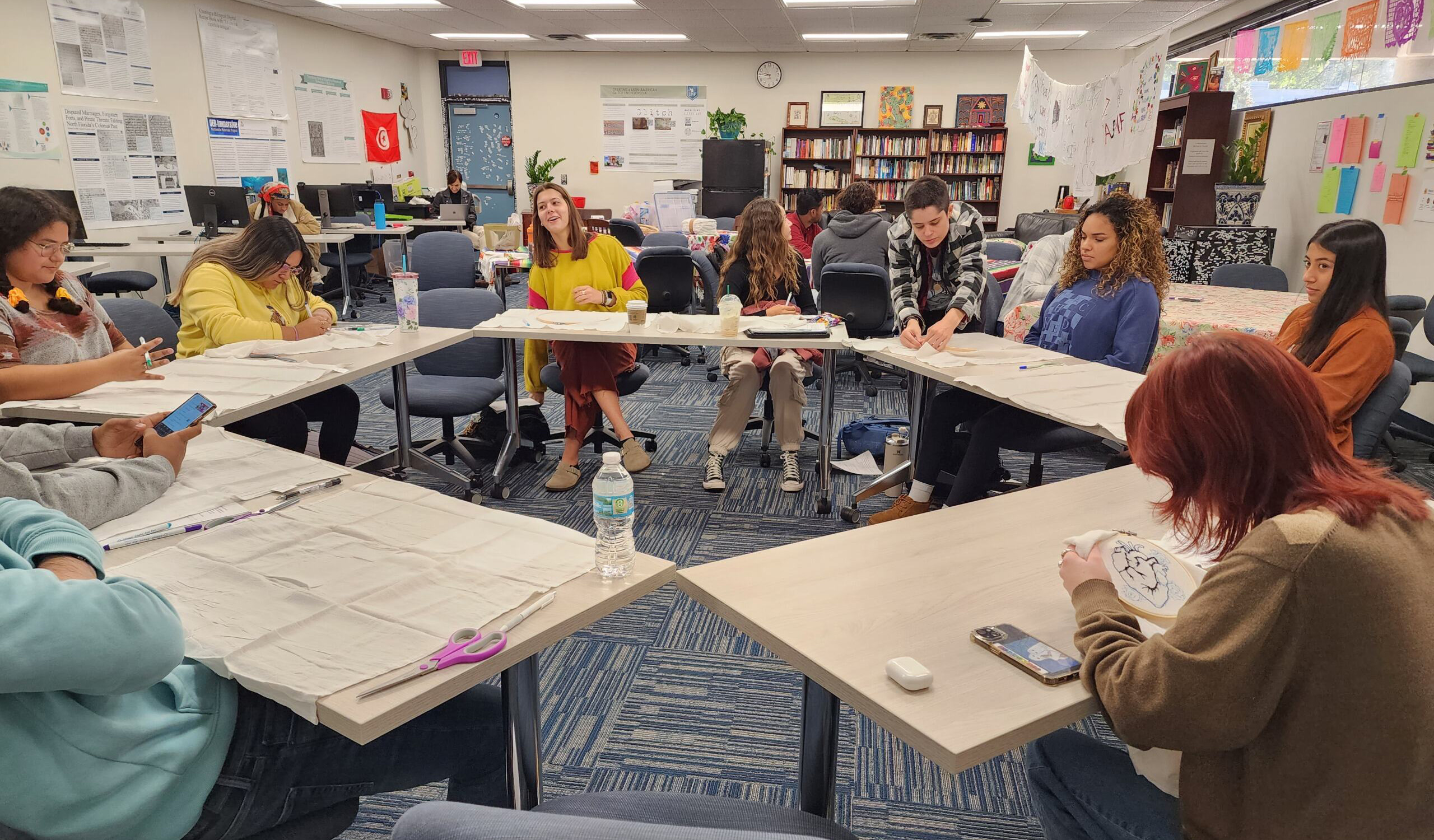 UNF students are shown embroidering at the annual event Embroidery for Peace and Memory in spring 2024