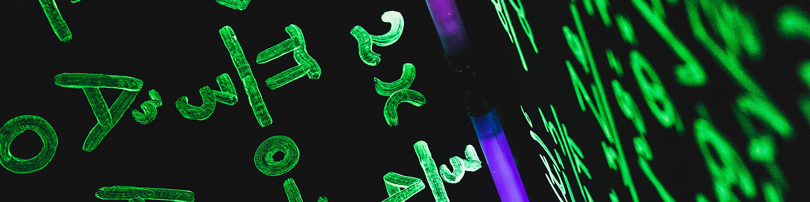 neon light with math equations on a ceiling