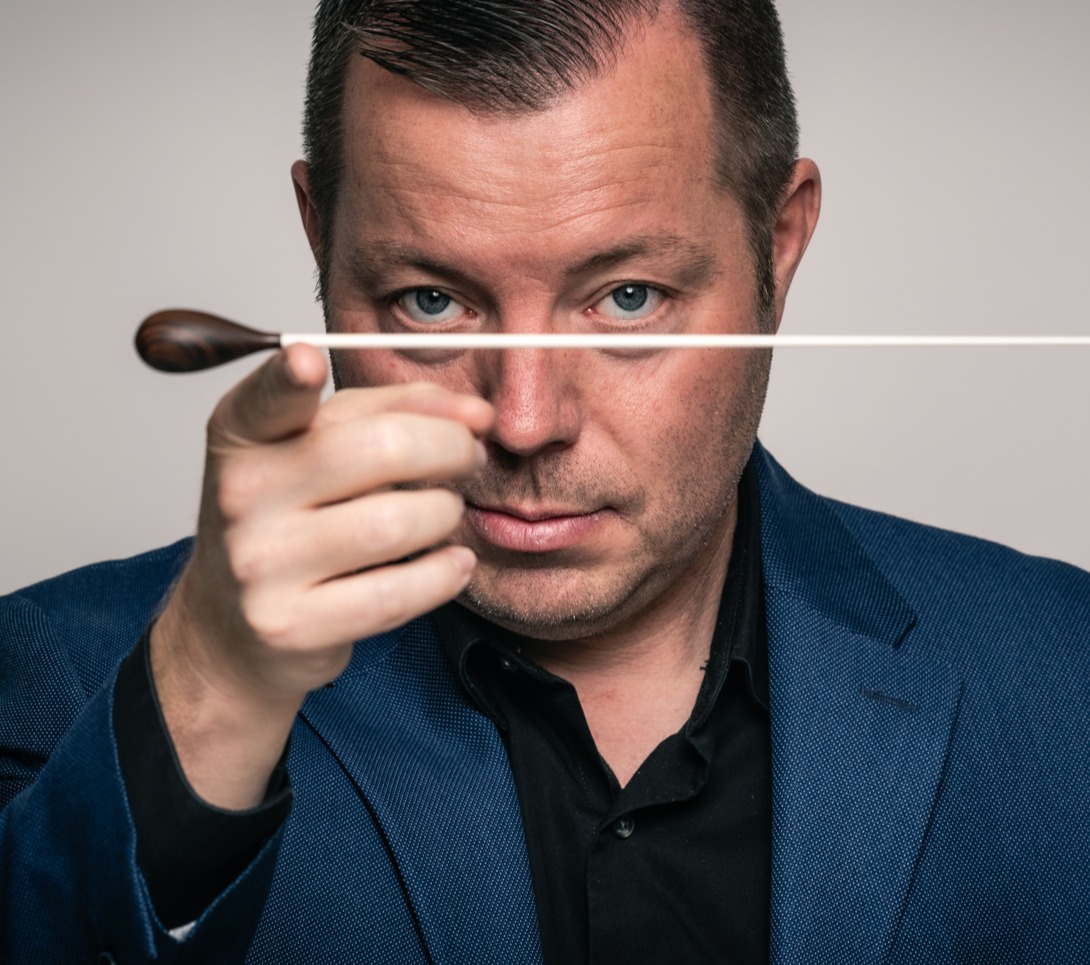 Man balancing a baton on his finger
