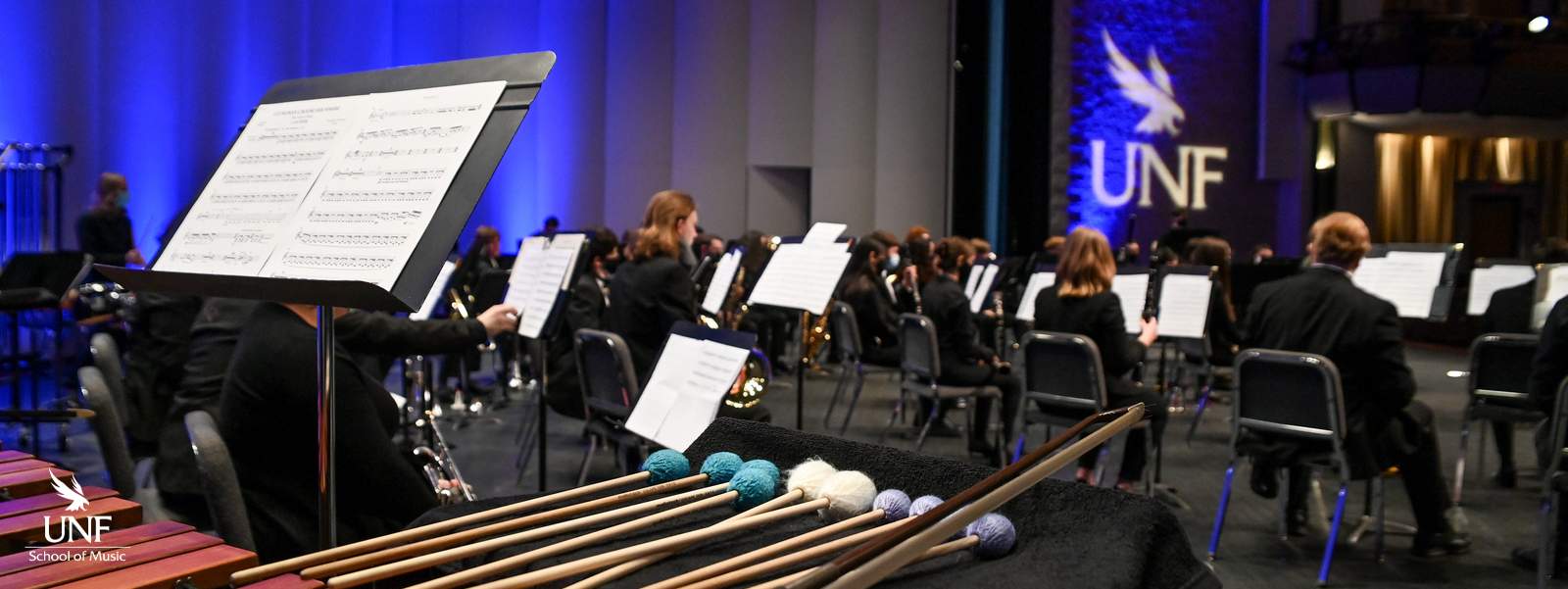 Music stand and percussion instruments on stage