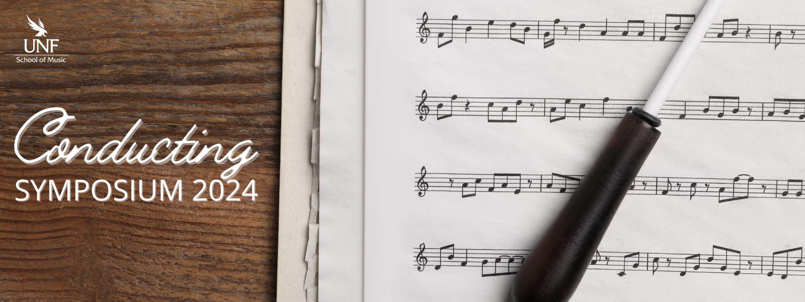 Picture of a conducting baton placed on a stack of sheet music