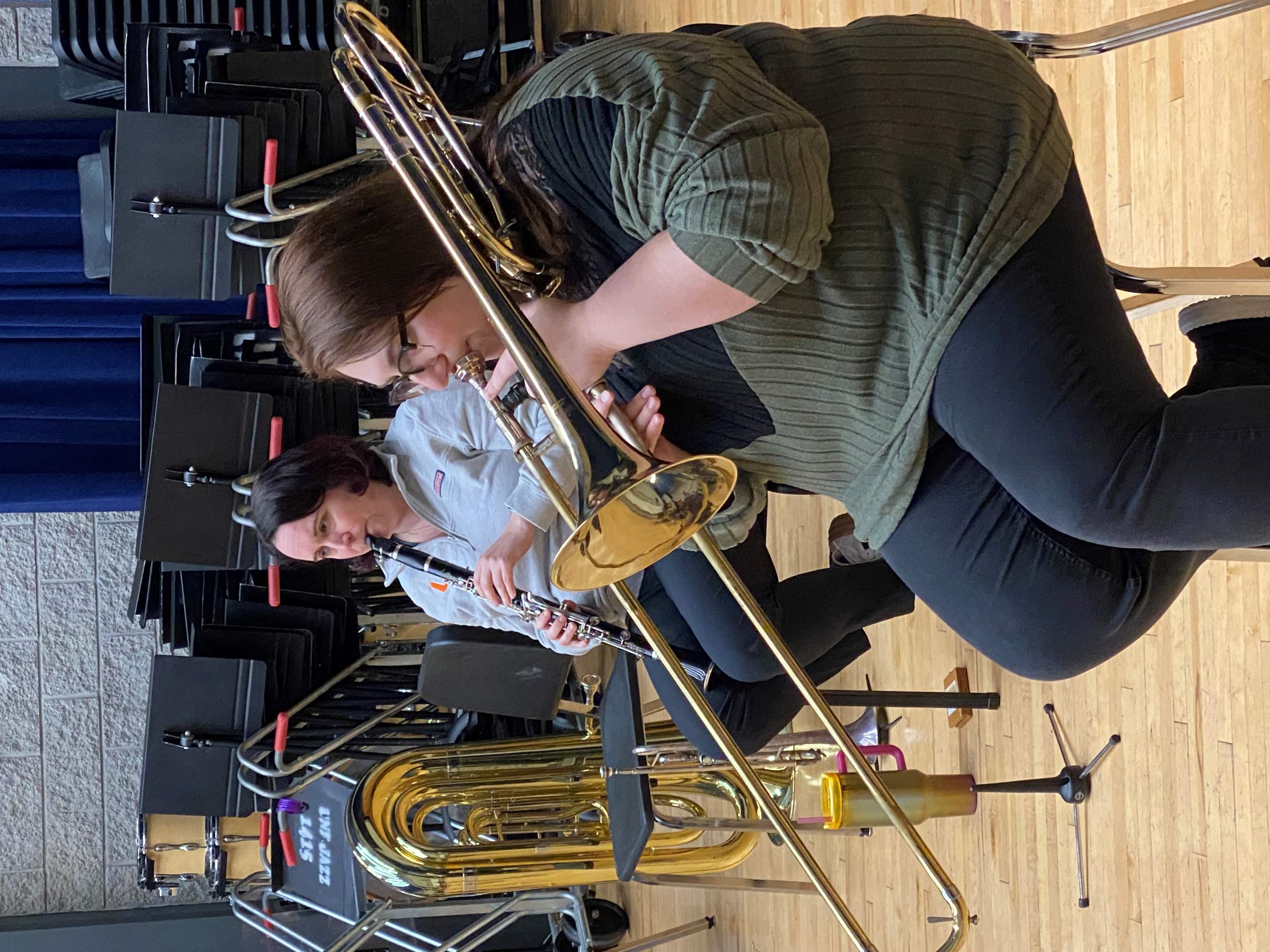Students playing clarinet and trombone