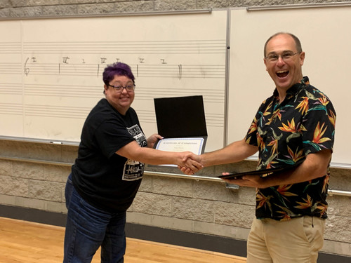 Woman receiving certificate
