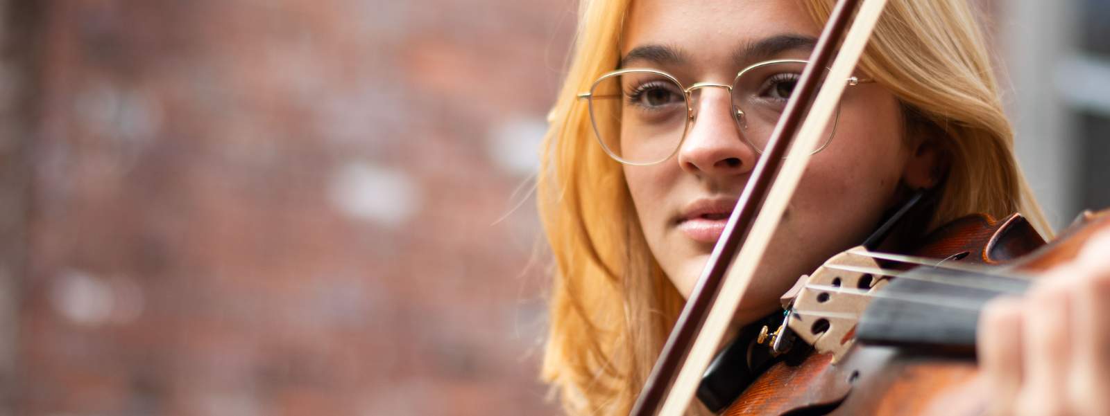 Young woman playing violin.