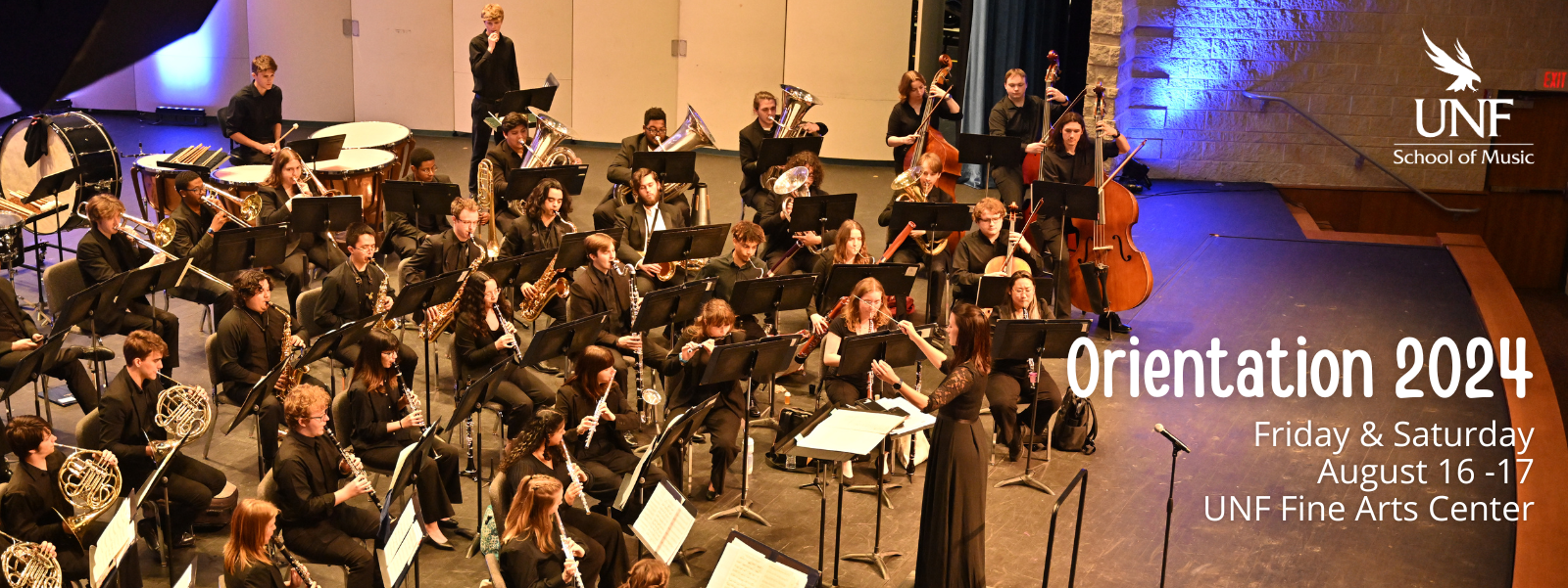 orientation 2024 - august 16 and 17 at the fine arts center - students playing wind and brass instruments on stage