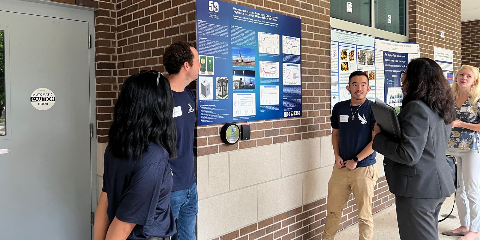 Student showing poster project