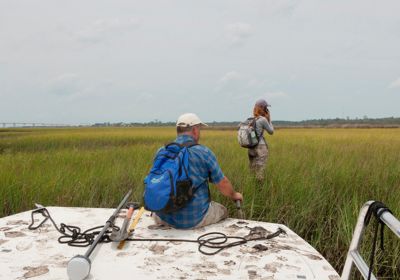 Student and Faculty in Marsh