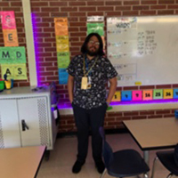 Allen Sorensen, standing in children's classroom