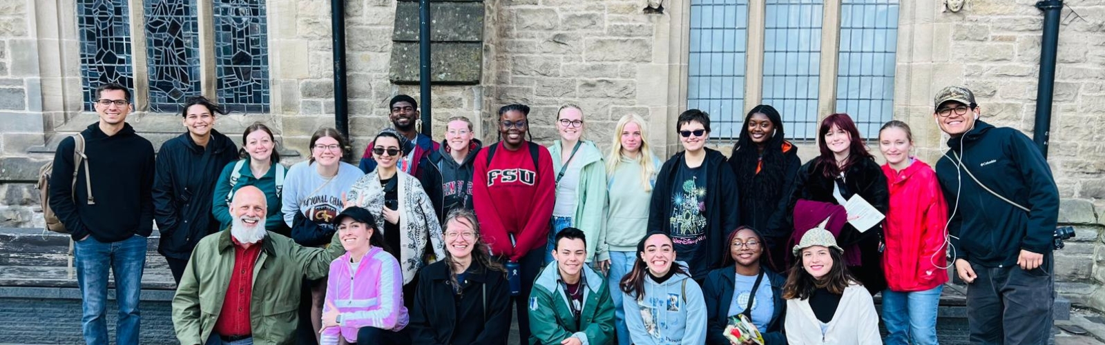 A group of UNF Students and professors smiling abroad