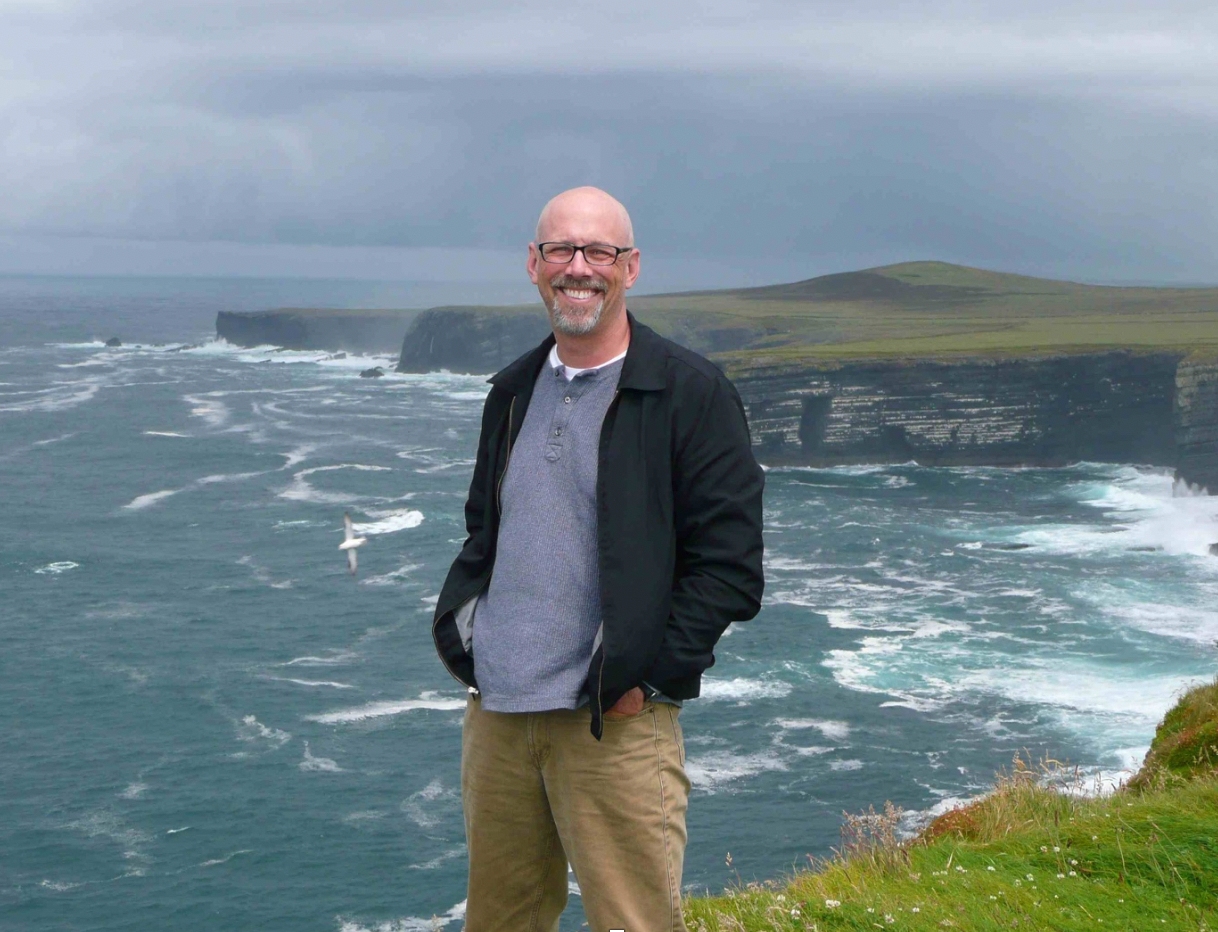 John Wesley White standing by a cliff