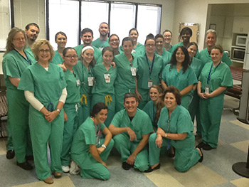 Health Care Interpreting students posing in scrubs