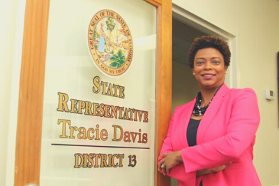 Tracie Davis standing by her office as a State Representative