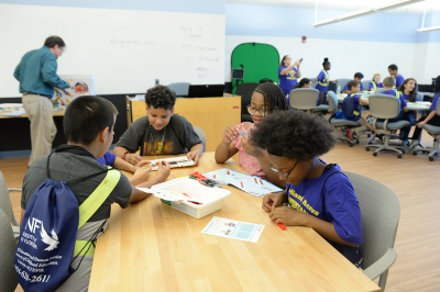 Group of young students in the Step Lab all working together