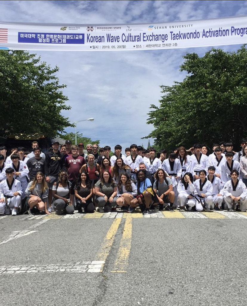UNF students pose with Korean Wave Cultural Exchange Taekwondo Activation Program participants