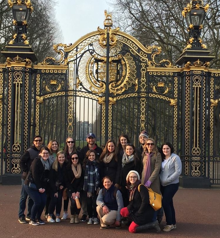 Sport management students pose in front of tourist attraction in England during study abroad trip with Dr. Liz Gregg