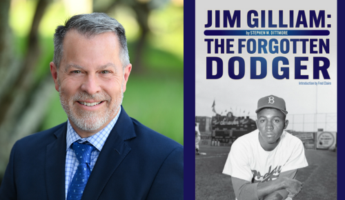Steve Dittmore with a photo of his book "Jim Gilliam: The Forgotten Dodger"