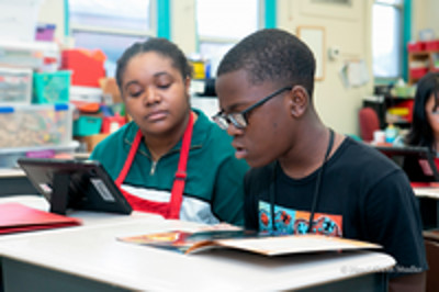 Read USA Tutor and student in a classroom