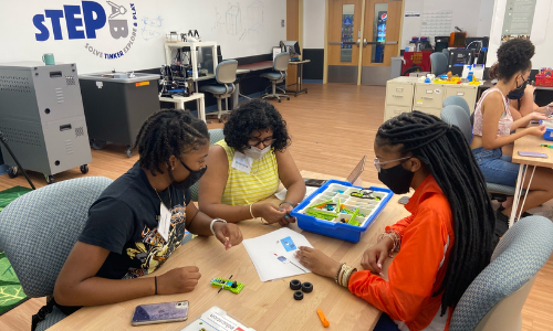 Students working together on a robotics build